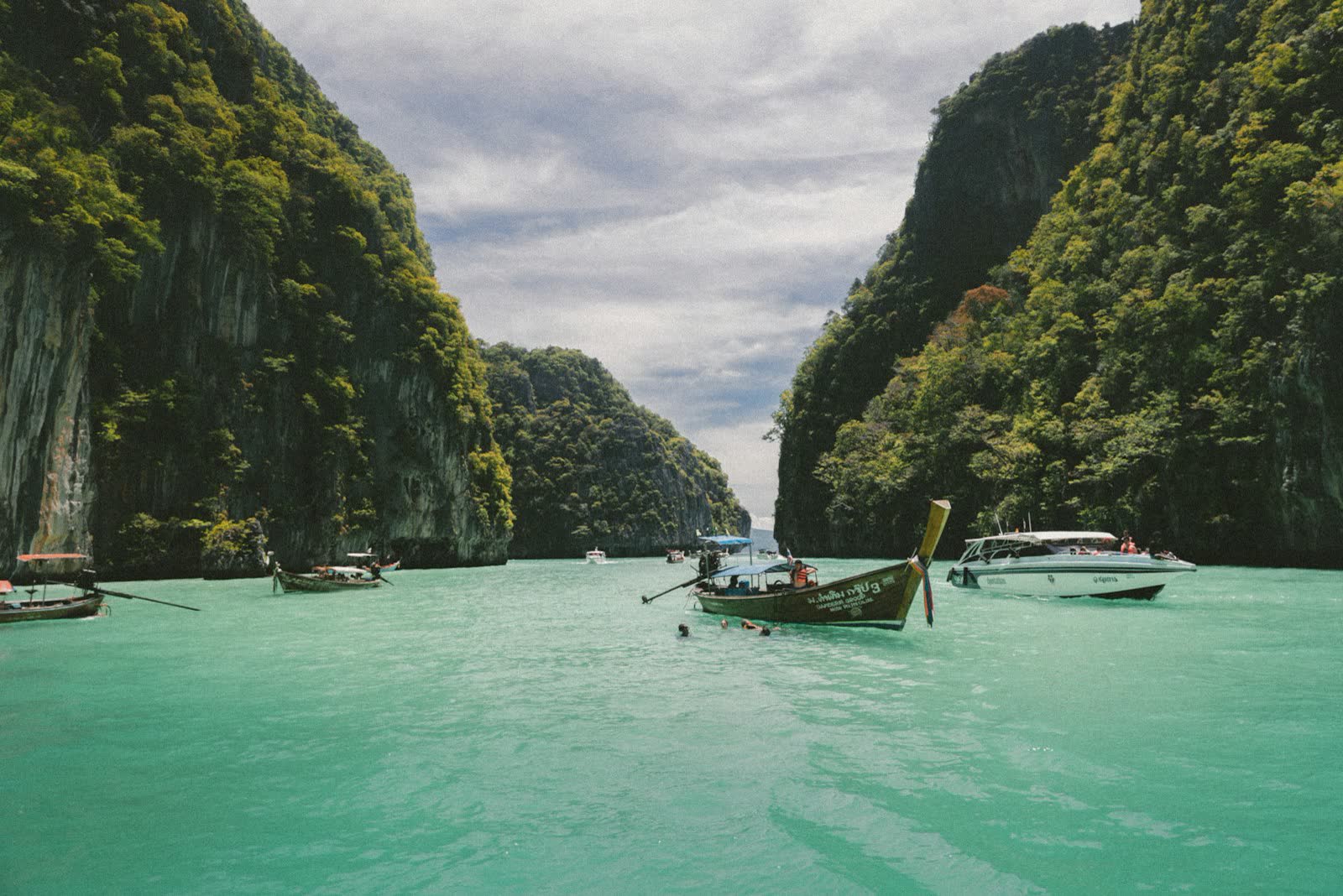 Traveler planning a Thailand trip on a laptop